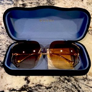Gucci sunglasses worn only one time which was walking out of the store!